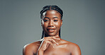 Beauty, black woman and smile with skincare in studio for healthy skin, natural glow or radiance. Mockup space, girl and portrait on gray background for acne treatment results, self care and wellness