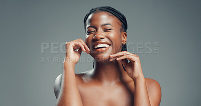 Buy stock photo Beauty, laughing and happy woman in studio for skincare, natural shine or soft texture for wellness. Dermatology, glow or black person with smooth skin, self care or space on gray background