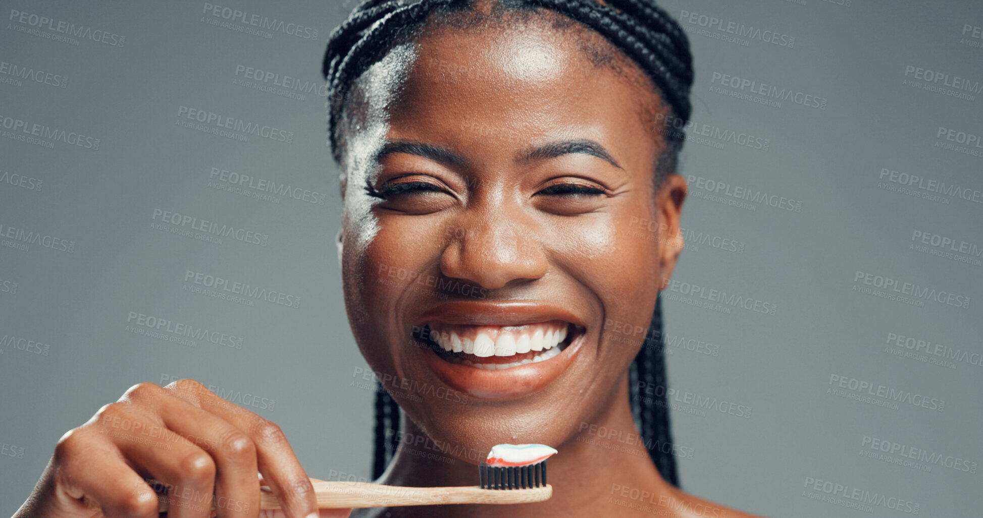Buy stock photo Bamboo toothbrush, dental wellness and happy woman with  oral health, fresh breath and gum care. Toothpaste, portrait and excited black person with natural orthodontics in studio on gray background