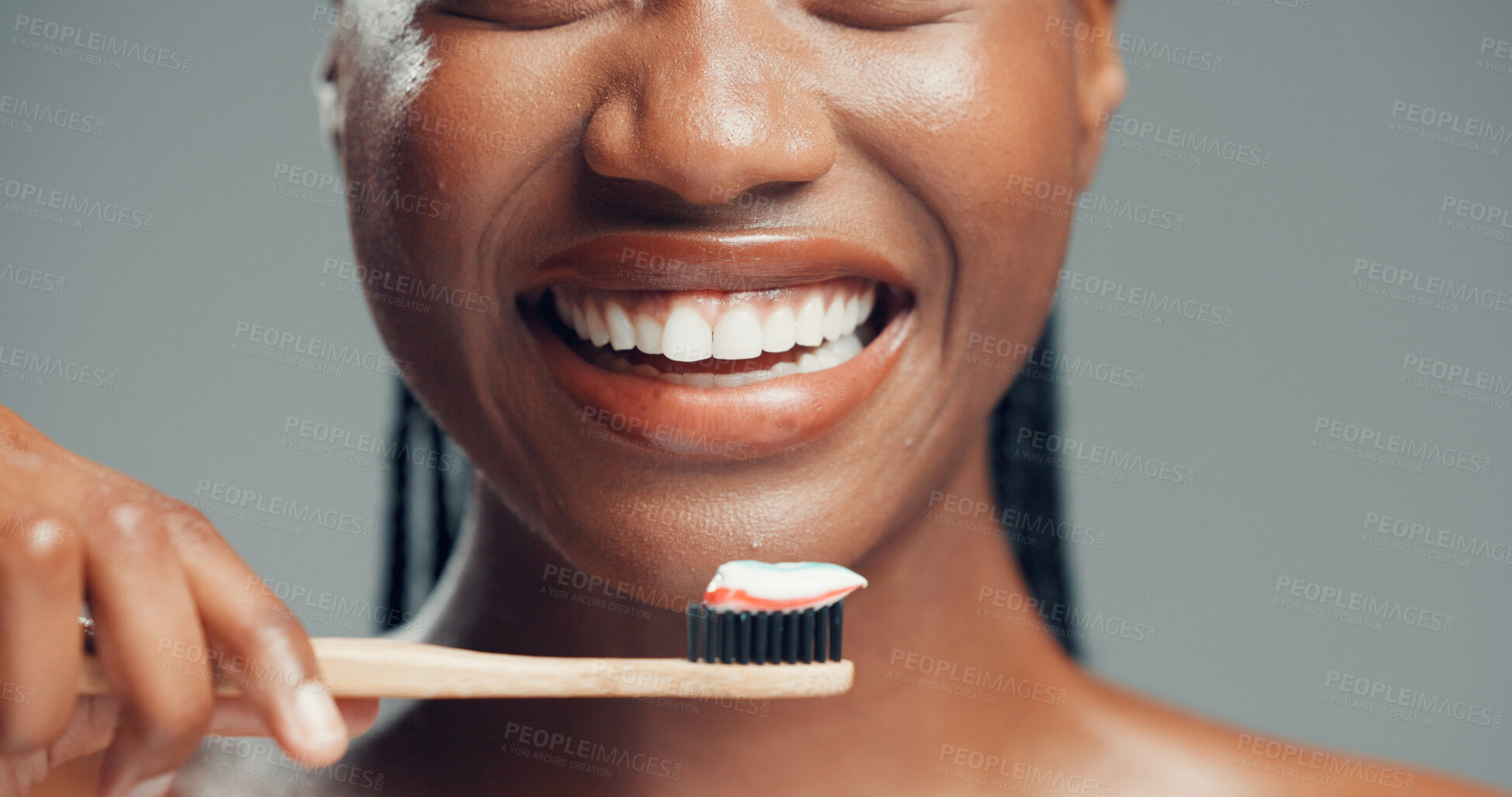 Buy stock photo Bamboo toothbrush, dental health and happy woman in studio, fresh breath and gum care. Toothpaste, eco friendly and hand of black person with oral hygiene, whitening or wellness on gray background