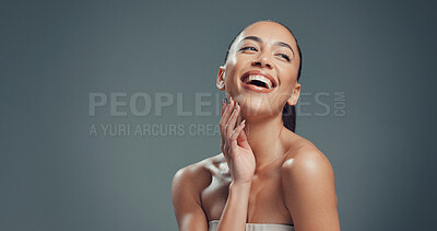 Buy stock photo Laughing, skincare and hands with woman in studio for beauty, self care and clear skin. Glow, dermatology and hydration with female person on gray background space for shine, aesthetic and mockup