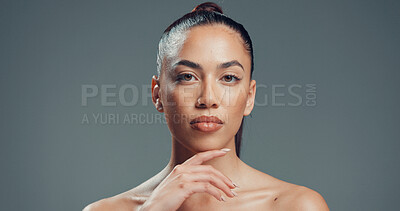 Buy stock photo Serious, skincare and portrait of woman in studio for beauty, self care and clear skin. Glow, dermatology and hydration with person on gray background space for shine, aesthetic and collagen