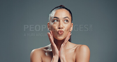 Buy stock photo Hands, skincare and pout with woman in studio for beauty, self care and clear skin. Glow, dermatology and hydration with female person on gray background space for shine, aesthetic and collagen