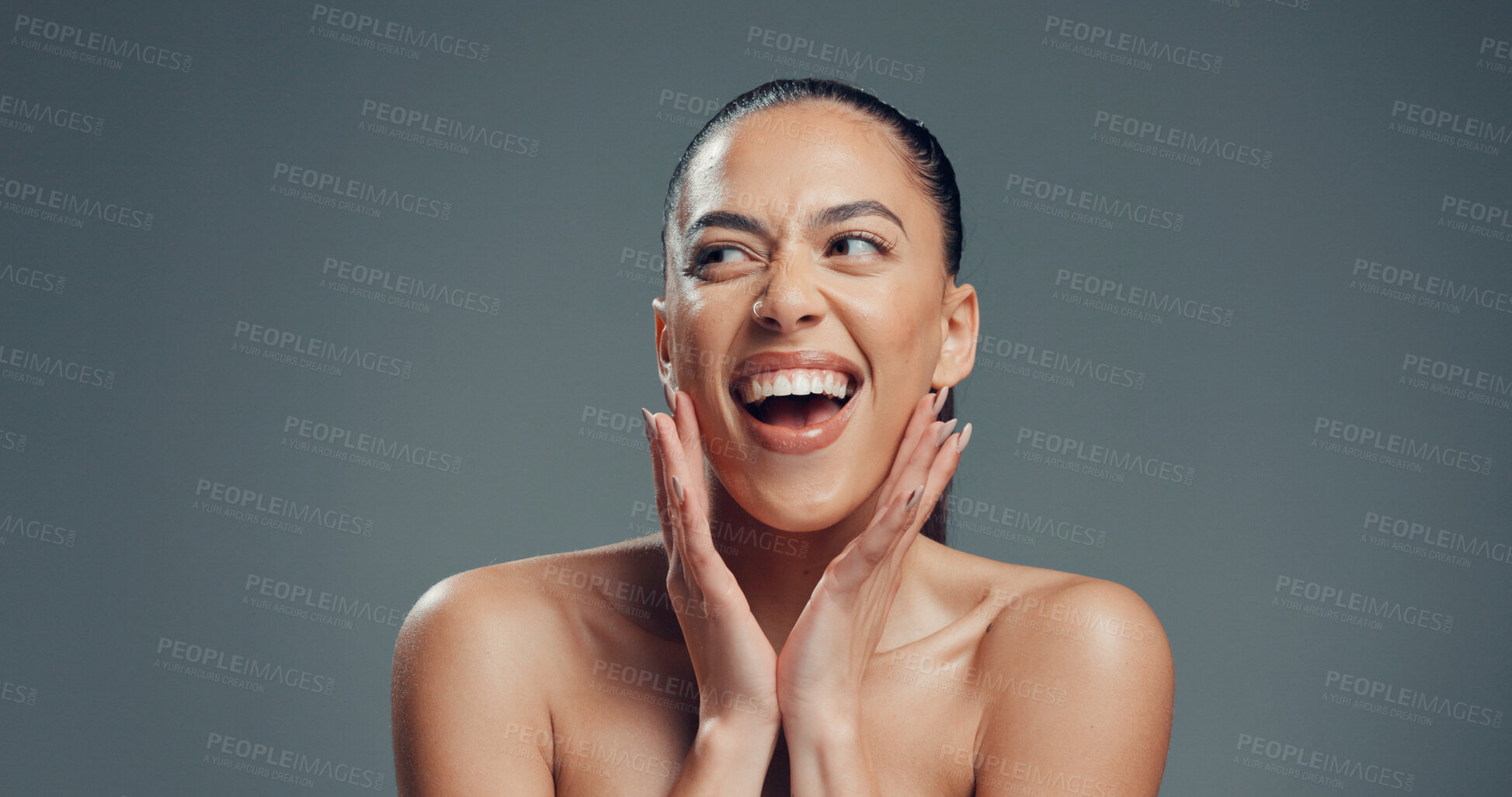 Buy stock photo Happy, skincare and hands with woman in studio for beauty, self care and clear skin. Glow, dermatology and hydration with excited person on gray background space for shine, aesthetic and collagen