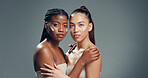 Skincare, cream and hug with portrait of women in studio for beauty, glow and self care diversity. Shine, dermatology and aesthetic with people on gray background space for lotion and support