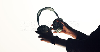 Buy stock photo Hands, person and advertising headphones in studio for audio, streaming music and sound equipment. Mockup space, brand ambassador or accessory promotion on white background for podcast, radio or song