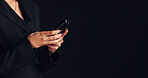 Phone, hands and businesswoman in studio with networking, communication or social media on app. Technology, typing and female person with cellphone for email, online or contact by black background.