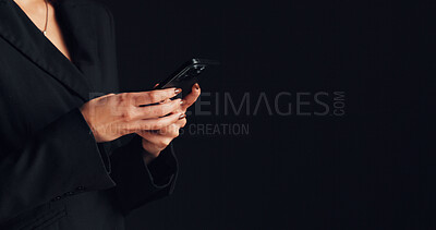 Buy stock photo Phone, hands and businesswoman in studio with networking, communication or social media on app. Technology, typing and female person with cellphone for email, online or contact by black background.