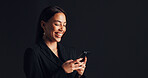Phone, happy and businesswoman in studio with networking, communication or social media on app. Technology, typing and female person with cellphone for email, online or contact by black background.
