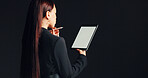 Mockup, businesswoman and thinking with tablet in studio for case review, legal decision or planning. Stylus, digital screen and back of lawyer on black background with trial preparation and solution