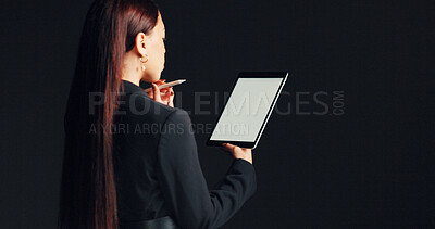 Buy stock photo Mockup, businesswoman and thinking with tablet in studio for case review, legal decision or planning. Stylus, digital screen and back of lawyer on black background with trial preparation and solution