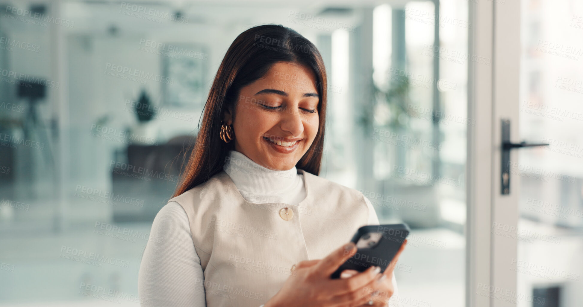 Buy stock photo Phone, smile and businesswoman in office with networking, communication or email on mobile app. Happy, technology and female person with cellphone for contact, texting or research online in workplace