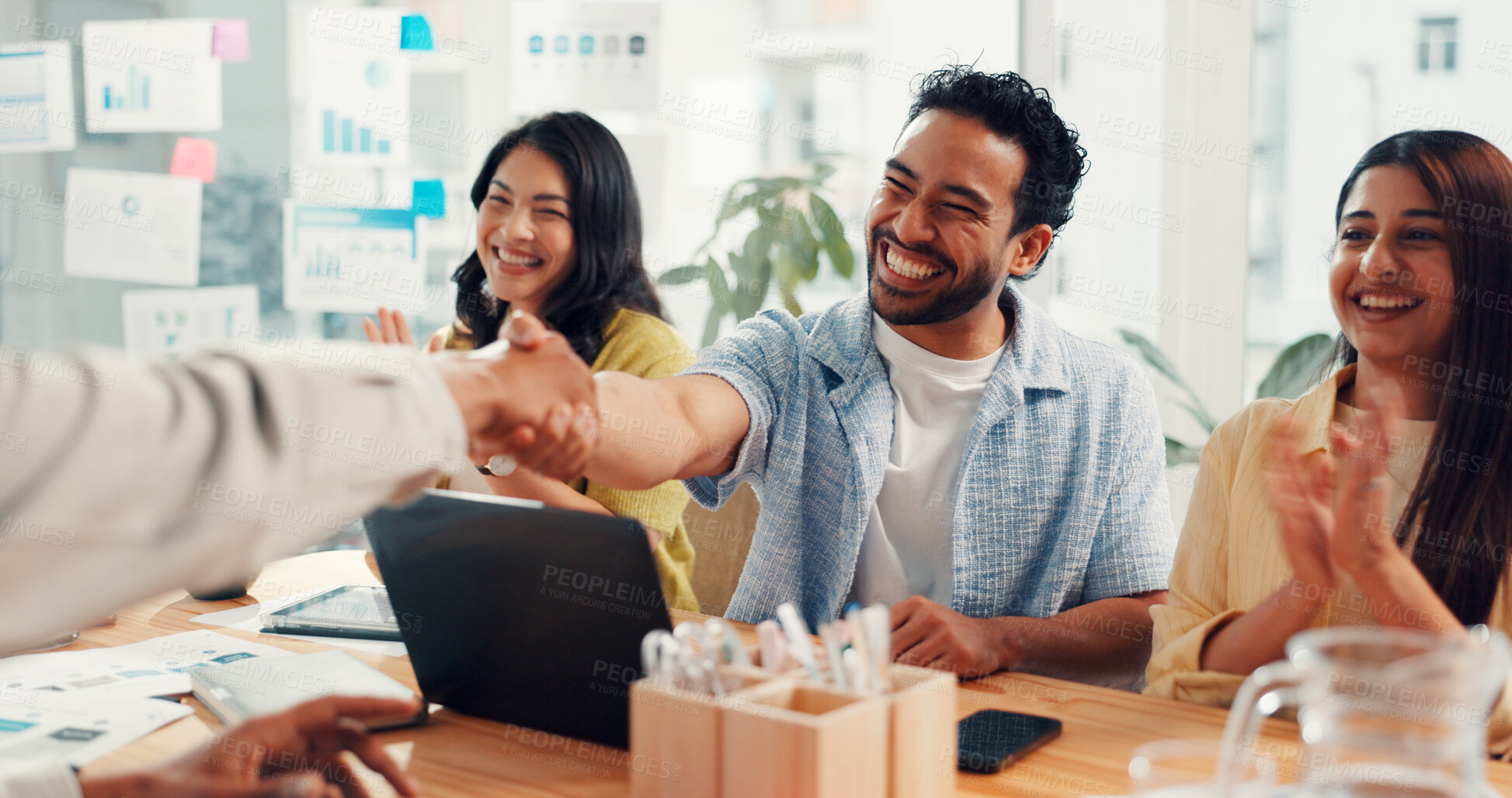 Buy stock photo People, handshake and celebration with applause at startup, goals and success at digital agency. Men, women and excited group with agreement, shaking hands and laptop with deal at office meeting