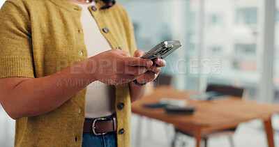 Buy stock photo Hands, phone and texting in office at startup, contact and notification for deal at media company. Person, smartphone and scroll with mobile app, chat or social network management at creative agency