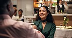 Couple, dating and toast in restaurant with wine for smile, romance or anniversary celebration. Hospitality, conversation and fine dining with man, woman and dinner with discussion and bonding