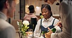 Couple, dating and smile in restaurant with wine for love, romance or anniversary celebration. Hospitality, conversation and fine dining with man, woman and dinner with discussion and bonding
