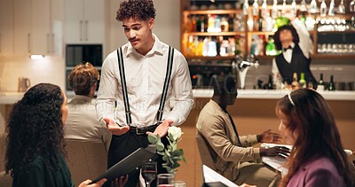 Buy stock photo Waiter, friends and talk at restaurant with menu, listen and recommend choice for wine, food or service. Women, man and customer experience with options, explain and discussion for decision at dinner