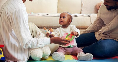 Buy stock photo Childhood, development and growth with black family on floor in living room of home together. Bonding, playing or toys with baby, mother and father in apartment for future, learning or support