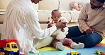 Childhood, development and teddy bear with black family on floor in living room of home together. Growth, playing or toys with baby, mother and father in apartment for future, learning or support