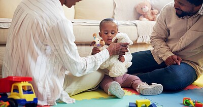 Buy stock photo Childhood, development and teddy bear with black family on floor in living room of home together. Growth, playing or toys with baby, mother and father in apartment for future, learning or support
