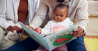Buy stock photo Family, child or reading with dinosaur book in home for story or childhood development. Mom, dad or toddler with kids novel, fairytale or literature for learning, bonding or fantasy together in house