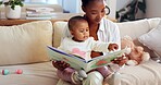 Black mom, child and reading with dinosaur book in home for story or childhood development. Mother, kid or toddler with novel, youth or literature for learning, bonding or fantasy together in house