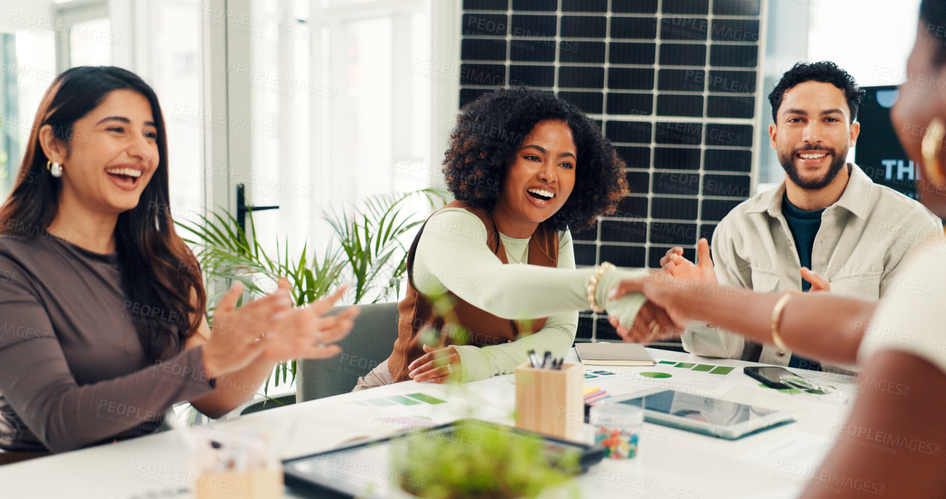 Buy stock photo Solar panel, shaking hands or team in office with clap, success or approval of sustainable project. Applause, tech or investor in agency with handshake, agreement or deal for photovoltaic grid pitch.