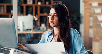 Buy stock photo Woman, headset and laptop with communication, documents and review for solution at media company. Person, consultant and virtual meeting with computer, problem solving and voip mic at creative agency