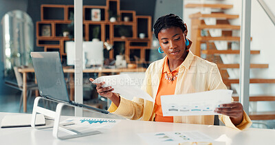 Buy stock photo Black woman, reading and documents at house for accounting, finance report and statistics. Person, remote work and laptop with paperwork, revenue graphs and financial comparison for audit information