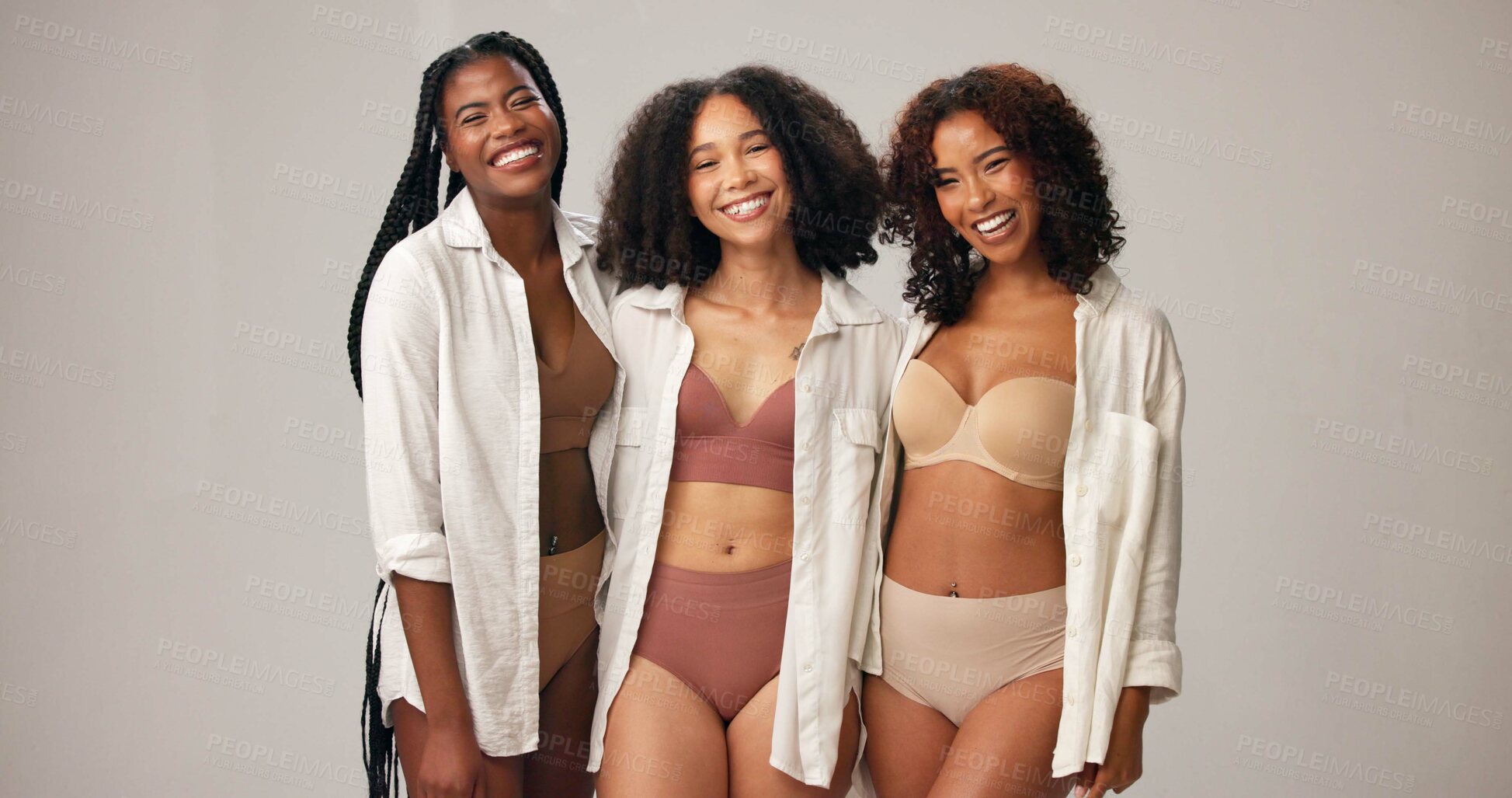 Buy stock photo Portrait, underwear and women in studio for body positivity, wellness and funny with natural beauty. Diversity, lingerie and friends with confidence, inclusion and laugh on gray background space