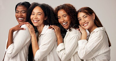 Buy stock photo Portrait, happy and women for beauty in studio with cosmetics, natural shine and solidarity. People, diversity and laugh for makeup, healthy skin and self care support of makeover on white background