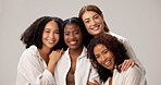 Portrait, happy and people for beauty in studio with cosmetics, natural shine and solidarity. Women, diversity and laugh for makeup, healthy skin and self care support of makeover on white background