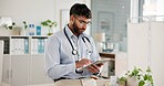 Medical, tablet and telehealth with doctor in hospital for planning, research or review of records. App, healthcare and information with man in office of clinic for feedback, report or results