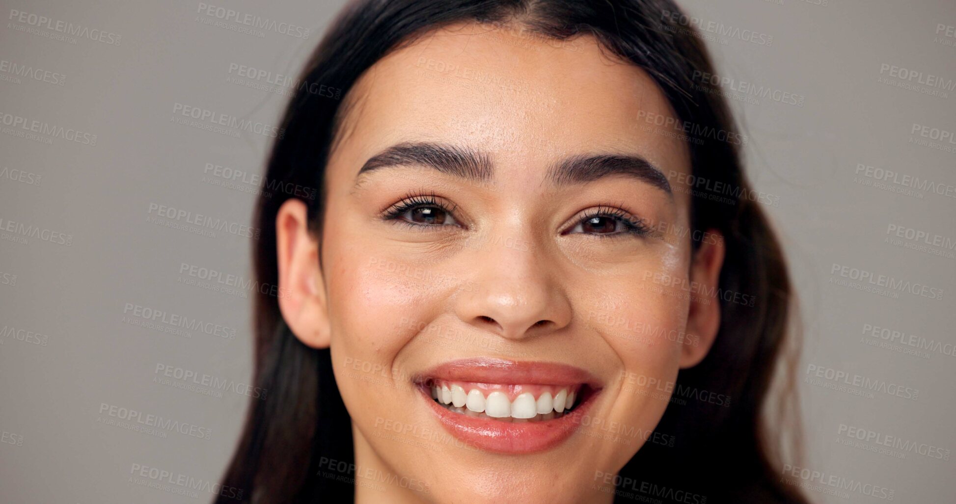 Buy stock photo Beauty, happy and portrait of woman in studio for cosmetics, wellness and skincare. Dermatology, mockup space and face of person with smile for natural texture, glow and shine on gray background