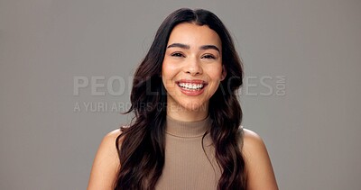 Buy stock photo Beauty, space and portrait of woman in studio for cosmetics, wellness and skincare. Dermatology, mockup and face of happy person with smile for natural texture, glow and shine on gray background