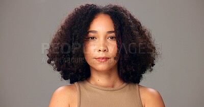 Buy stock photo Haircare, portrait and woman in studio, serious or maintenance of texture, shine and gray background. Beauty, African person and confident for healthy hair, growth and self care for hairstyle
