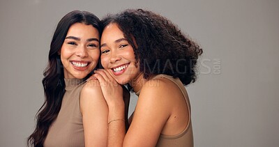 Buy stock photo Portrait, women and laugh in studio, haircare and nourishment of texture, growth or gray background. Friends, embrace and people with smile with natural hairstyle, space or self care with cosmetics