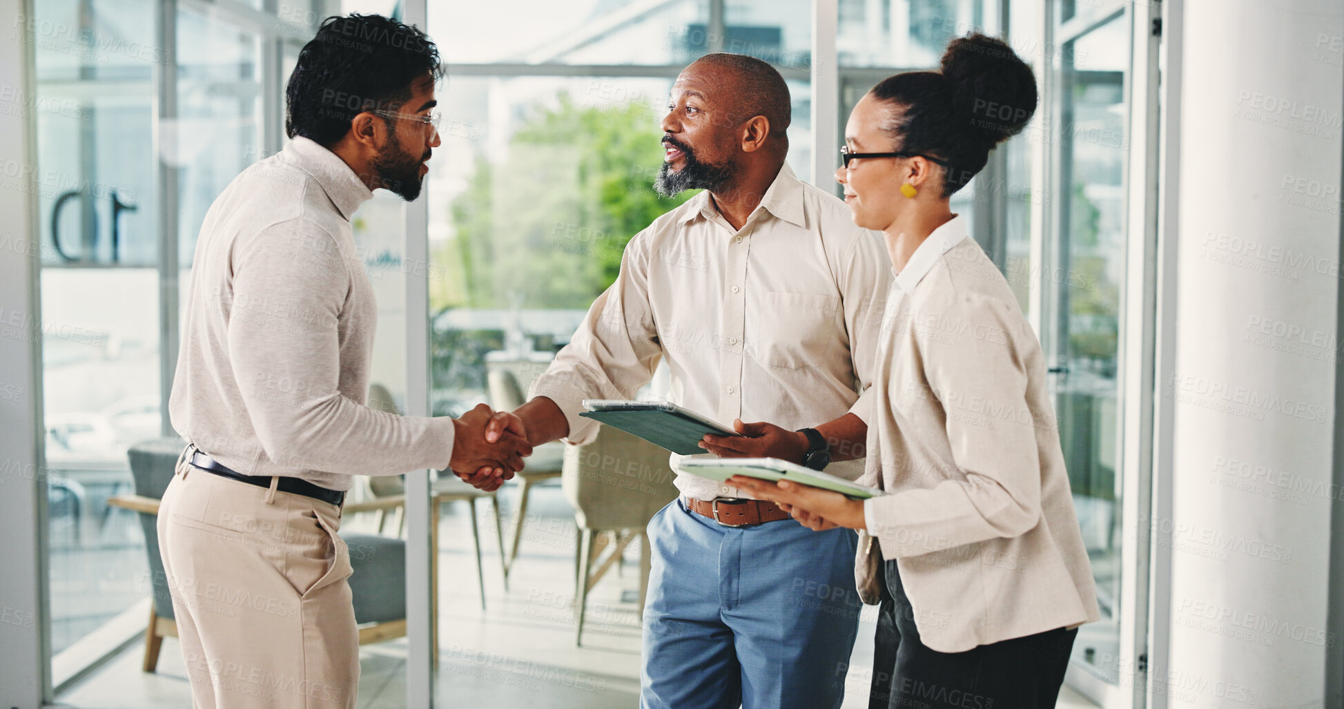 Buy stock photo Business people, handshake and happy with tablet, recruitment and welcome with team at office. Men, woman and excited with shaking hands, tech and congratulations for hiring at human resources agency