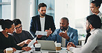 Business people, meeting and documents with laptop for analytics, statistics or company revenue. Group, employees or colleagues with paperwork, computer or proposal for corporate performance review