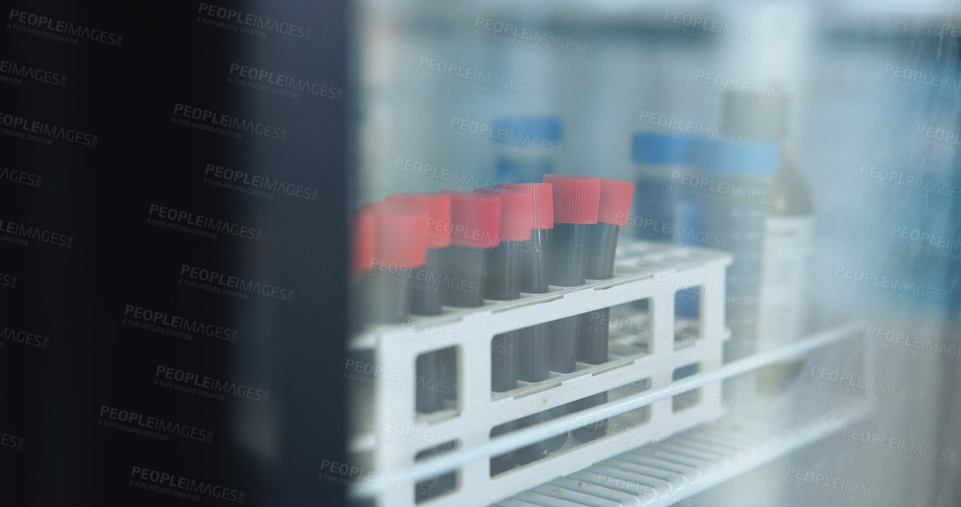 Buy stock photo Science, tube and vial with blood in fridge for biotech, dna investigation and medical research. Container, sample and liquid in freezer for genetic testing, stem cell innovation or scientific study.