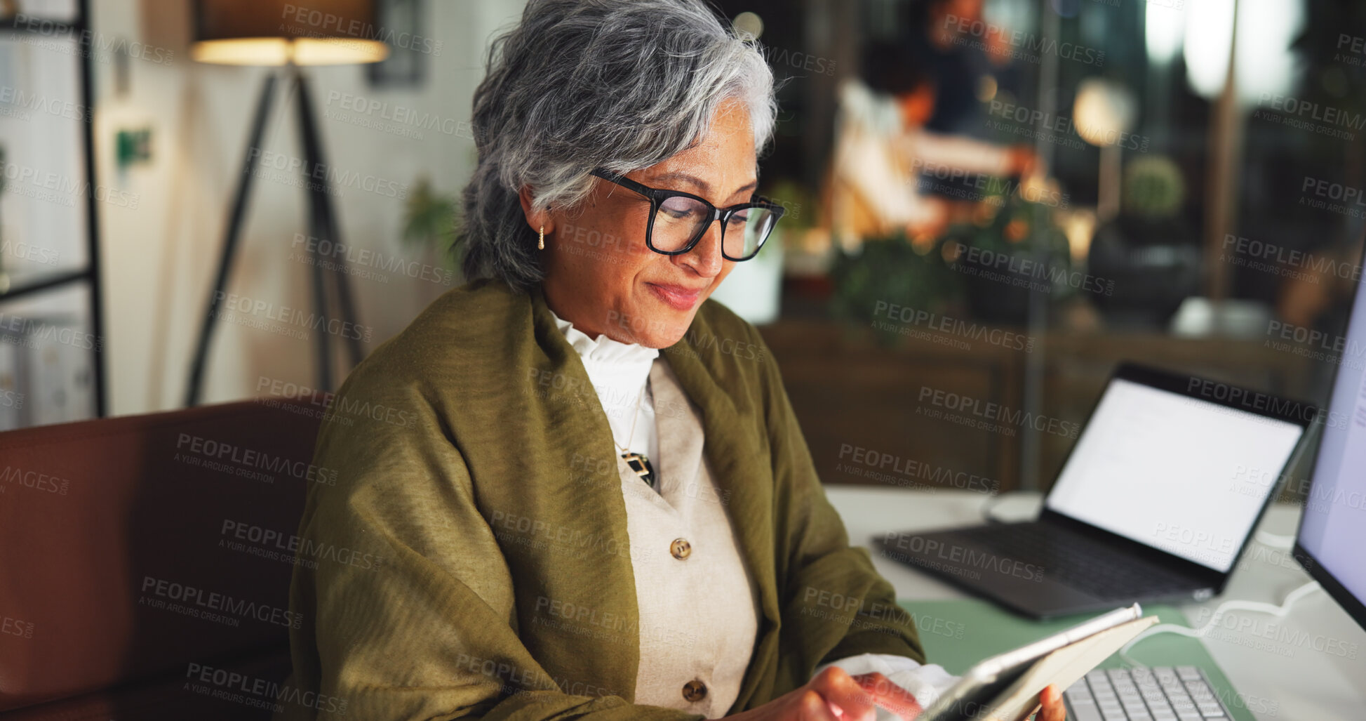 Buy stock photo Tablet, smile and reading with business woman in office for marketing campaign, night and news vision. Digital branding, online and research with mature employee in media agency for article deadline