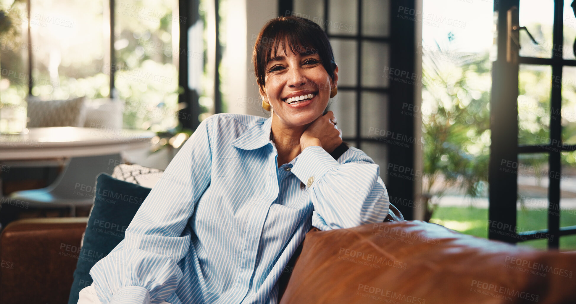 Buy stock photo Mature woman, portrait and smile on home sofa with confidence, comfort or positive attitude. Funny humor, apartment and female homeowner happy on living room couch to relax, laugh and wellness