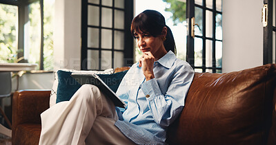 Buy stock photo Tablet, thinking and woman in home for freelance, article idea or inspiration for newsletter. Technology, mature copywriter or remote work in living room for planning story, decision or reading email
