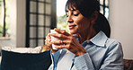 Woman, smell coffee or reflection on couch with memories, contemplation or daydreaming about past. Mature person, thinking or beverage on sofa for peaceful moment, relax or chill in home living room.