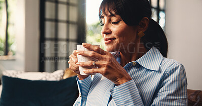 Buy stock photo Woman, smell coffee or reflection on couch with memories, contemplation or daydreaming about past. Mature person, thinking or beverage on sofa for peaceful moment, relax or chill in home living room.