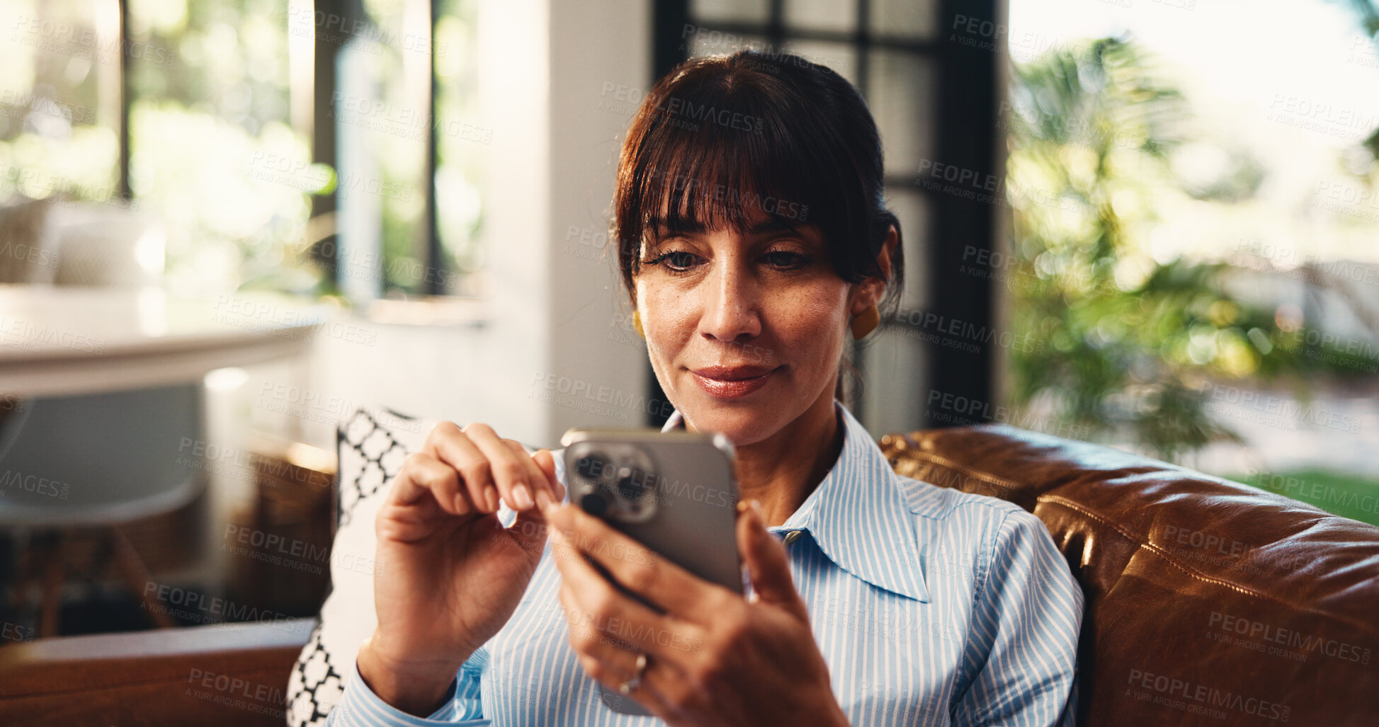 Buy stock photo Scroll, reading or woman on couch with phone, online streaming or message on social media. Smile, chat or mature person in house with tech, e book subscription or email update on digital app.