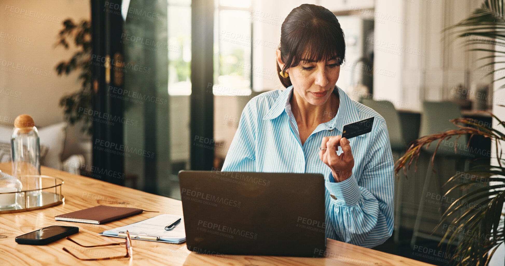 Buy stock photo Woman, virtual assistant and credit card with laptop in home, remote work and payment for booking. Mature person, ecommerce and online banking with fintech, bills and easy transaction at apartment