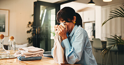 Buy stock photo Woman, smell laundry and fold in home with hygiene, scent and organize with chores for routine. Mature person, clothes and fabric with fragrance, cleaning and packing with sanitation at apartment
