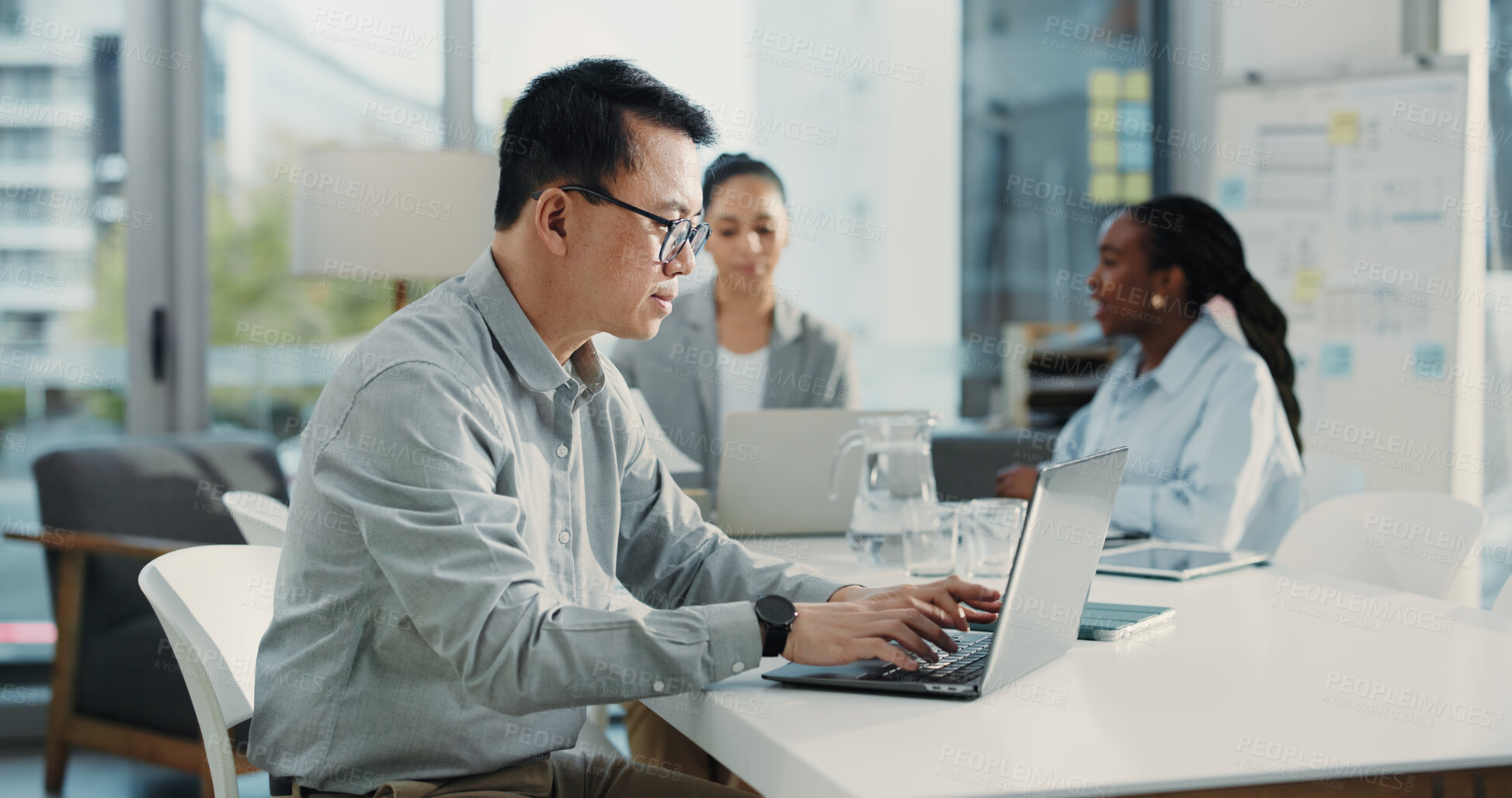 Buy stock photo Businessman, project manager and laptop with team for schedule plan or setting deadline in office. Man, coordinator or typing with computer for task delegation, company budget or agenda in workplace