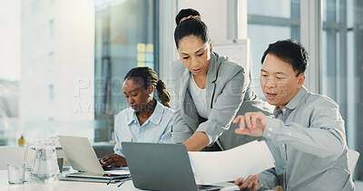 Buy stock photo Business people, laptop and meeting with feedback for document, proposal or accounting report at office. Group of employees, paperwork and discussion for company revenue, profit or financial growth